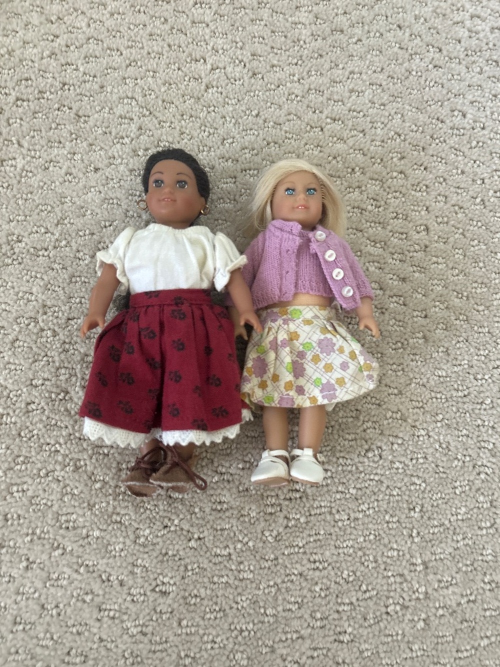 2 mini American girl dolls